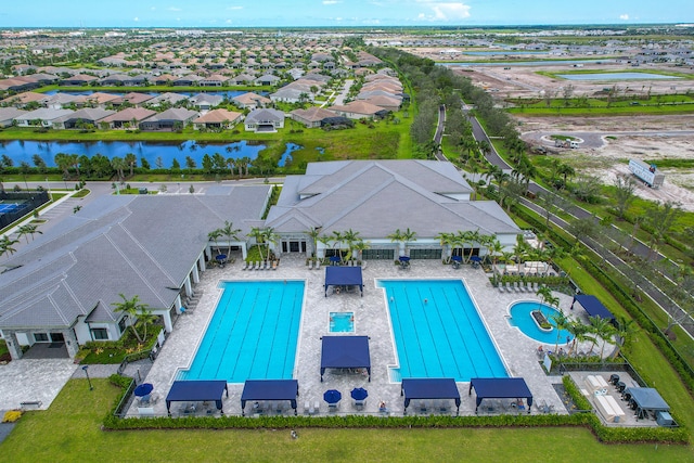 view of pool featuring a water view