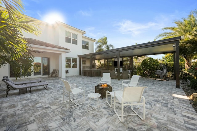 view of patio featuring a fire pit