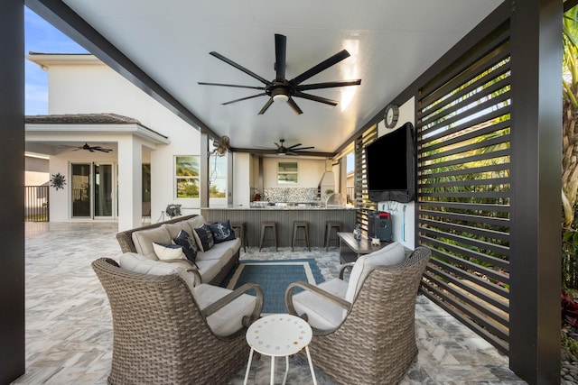 view of patio / terrace with an outdoor living space and an outdoor bar