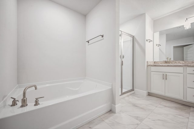 bathroom featuring separate shower and tub and vanity