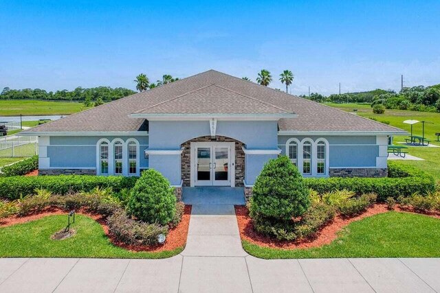 ranch-style house with french doors