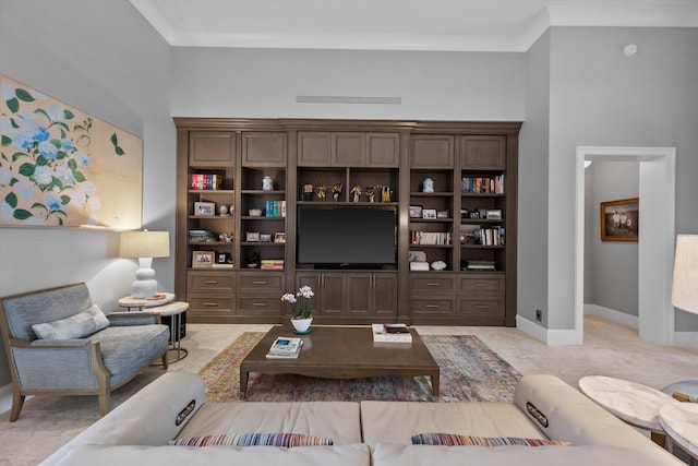 living room with crown molding and light carpet