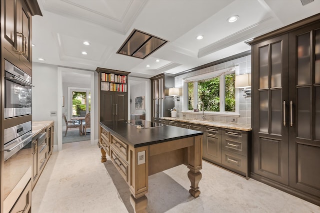 kitchen featuring crown molding, a wealth of natural light, sink, and stainless steel appliances