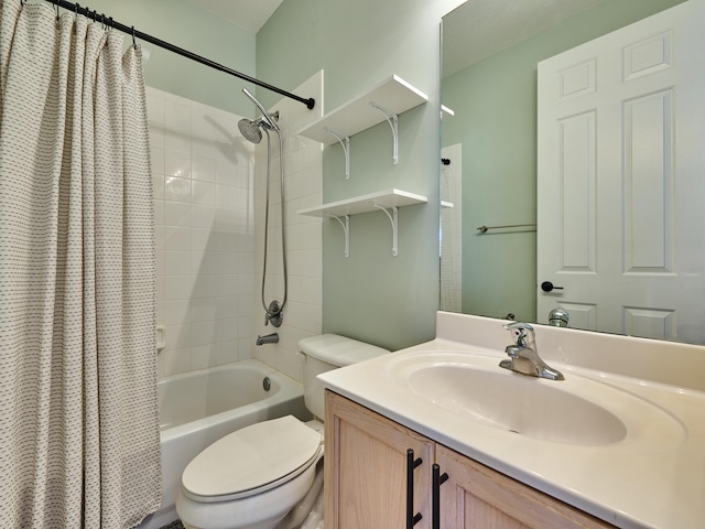 full bathroom with vanity, toilet, and shower / tub combo