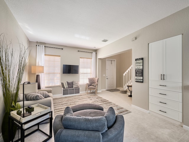 living room with a textured ceiling