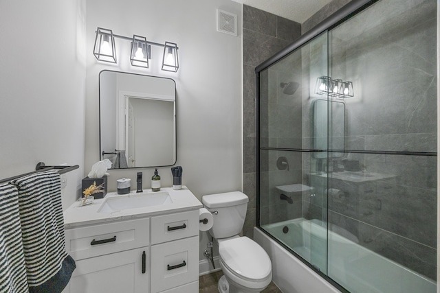 full bathroom with shower / bath combination with glass door, vanity, and toilet