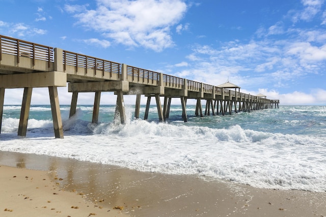 dock area featuring a view of the beach and a water view