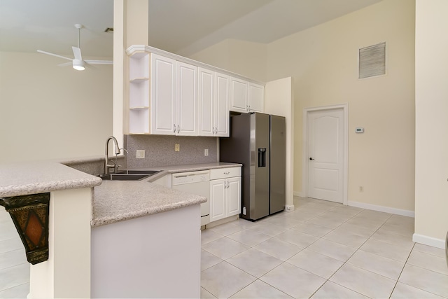 kitchen featuring white dishwasher, sink, white cabinetry, and stainless steel fridge with ice dispenser