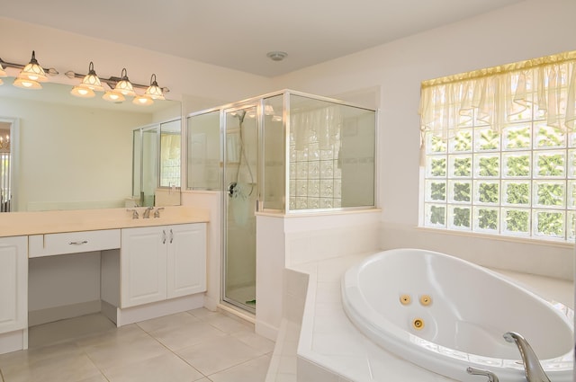 bathroom with independent shower and bath, vanity, and tile patterned floors