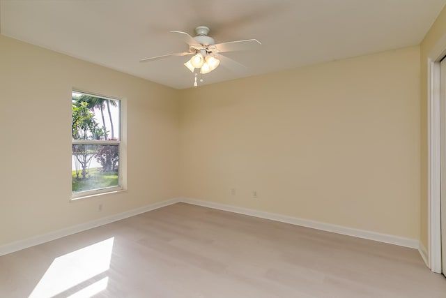 spare room with ceiling fan and light hardwood / wood-style floors