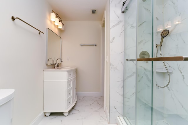 bathroom with vanity and a shower with shower door