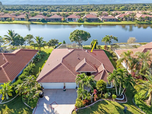 birds eye view of property with a water view