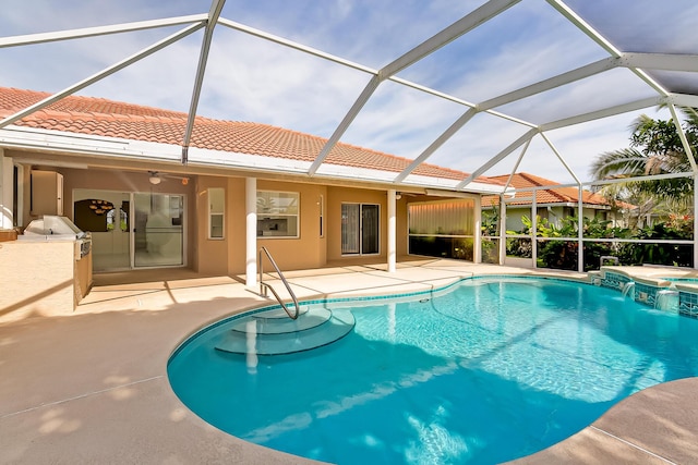 view of swimming pool featuring an in ground hot tub, a lanai, and a patio area