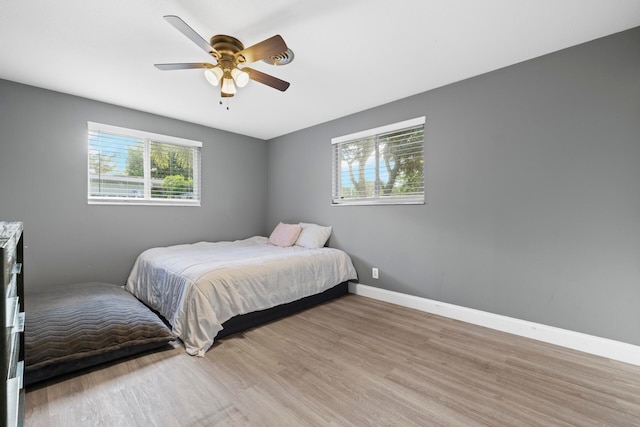 bedroom featuring ceiling fan and light wood-type flooring