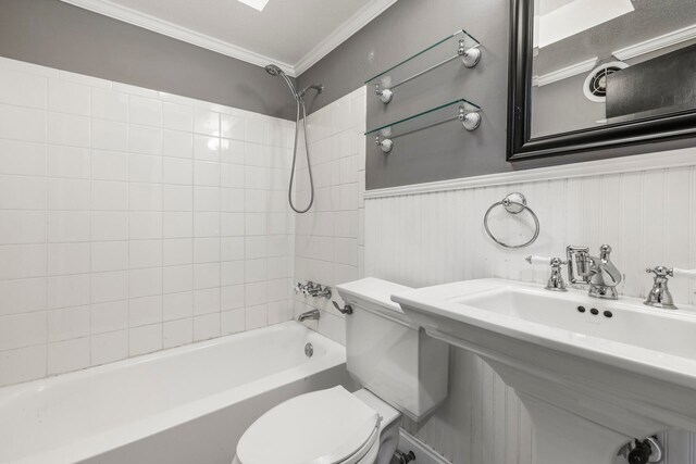 full bathroom with sink, toilet, tiled shower / bath combo, and ornamental molding