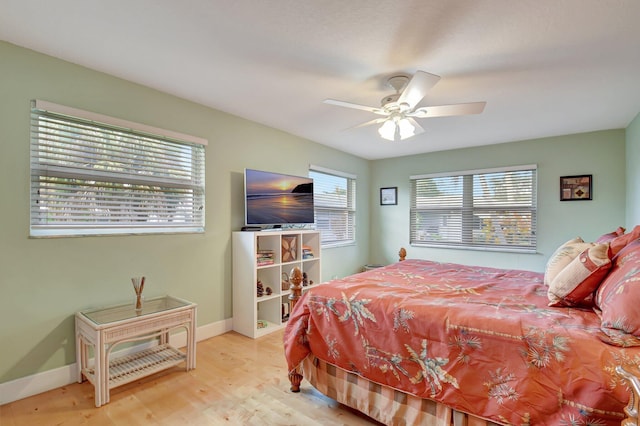 bedroom with light wood-type flooring and ceiling fan