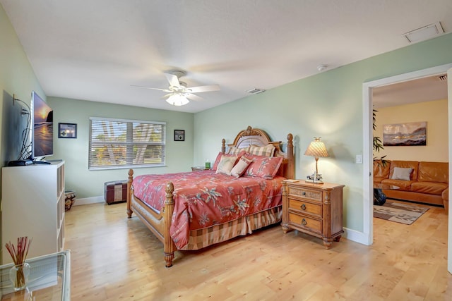 bedroom with light wood-type flooring and ceiling fan