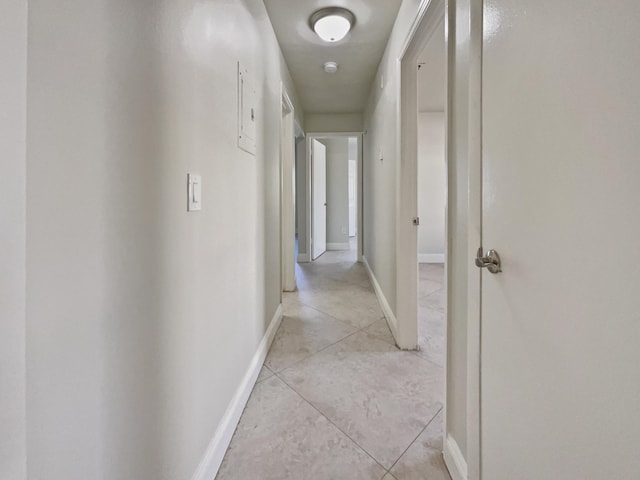 hallway with light tile patterned floors