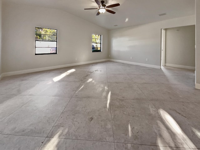 spare room with ceiling fan and vaulted ceiling