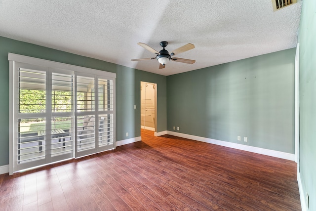 spare room featuring a textured ceiling, dark hardwood / wood-style flooring, and ceiling fan