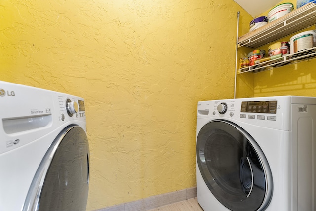 laundry room featuring washer and clothes dryer