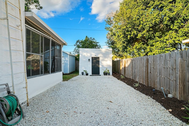 view of yard with a patio area and a storage shed