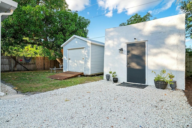 view of outbuilding featuring a yard