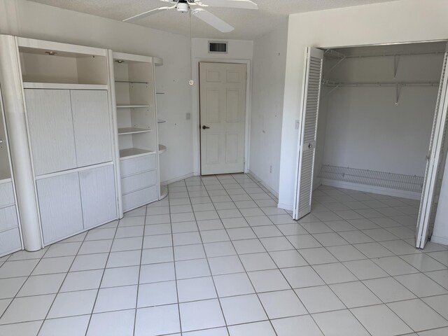7516 N Devon Dr Unit 212, Tamarac, FL 33321 - unfurnished bedroom featuring a closet, a ceiling fan, and baseboards