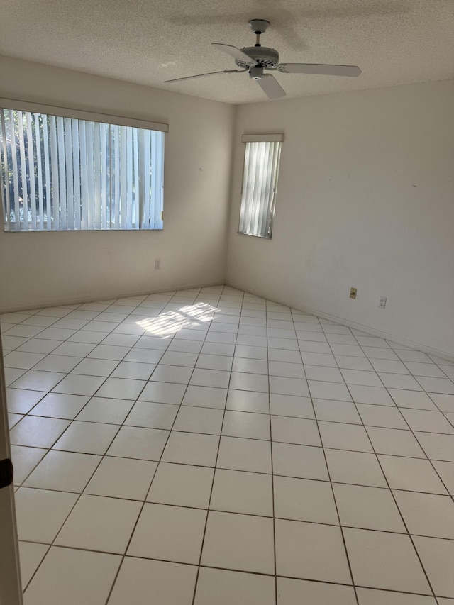 7516 N Devon Dr Unit 212, Tamarac, FL 33321 - spare room with a ceiling fan, a textured ceiling, and light tile patterned floors