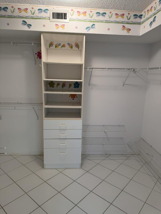7516 N Devon Dr Unit 212, Tamarac, FL 33321 - walk in closet with light tile patterned floors