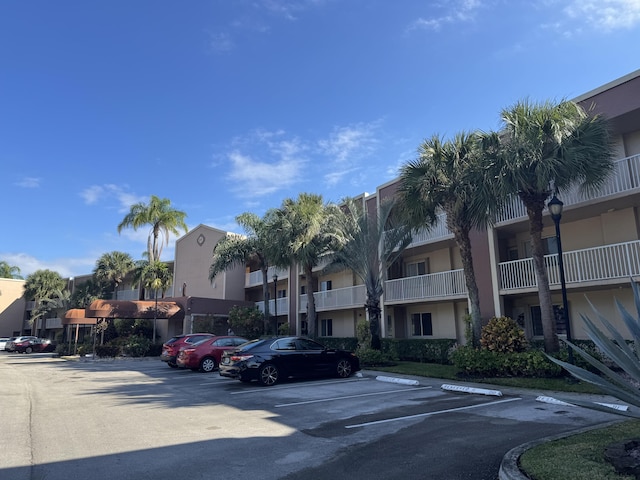 7516 N Devon Dr Unit 212, Tamarac, FL 33321 - view of building exterior with uncovered parking