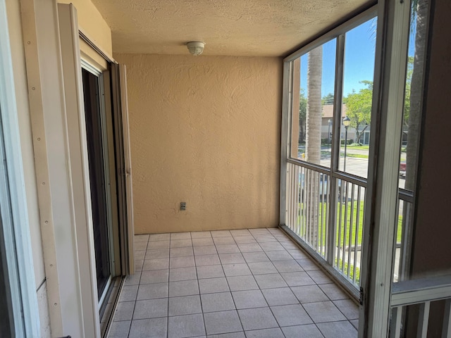 unfurnished sunroom with a wealth of natural light