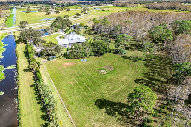 birds eye view of property with a rural view and a water view