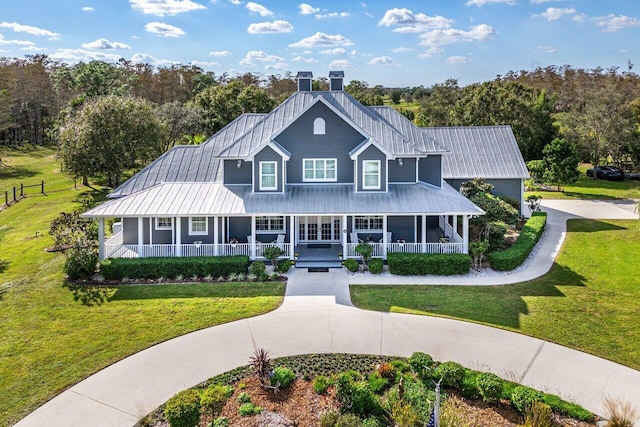 view of front of house featuring a front yard and a porch