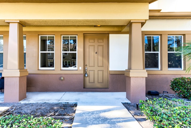 property entrance featuring covered porch