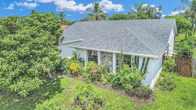 view of side of home with a lawn