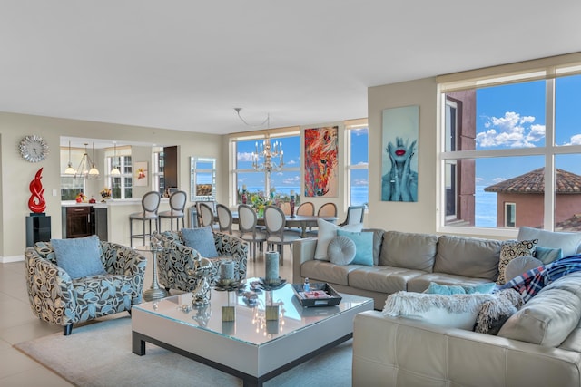 tiled living room featuring a chandelier