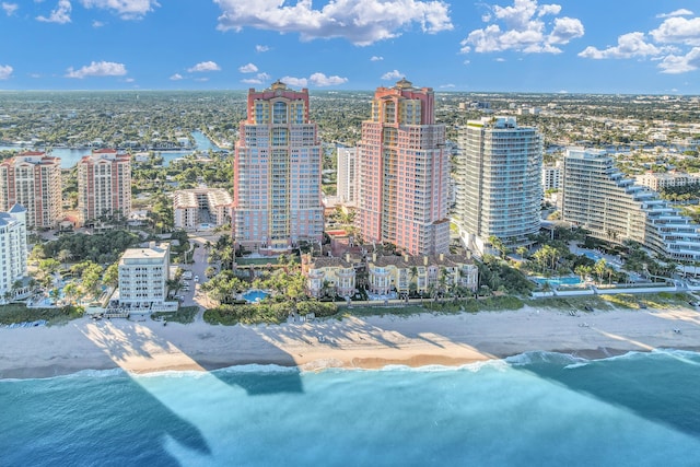 exterior space featuring a water view and a beach view