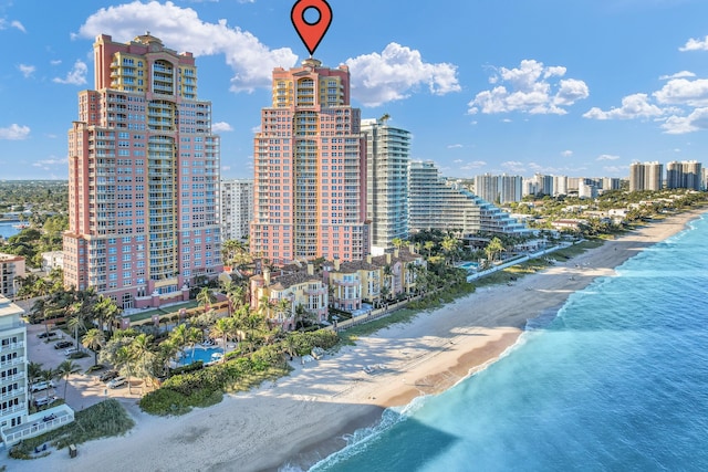 aerial view with a view of the beach and a water view