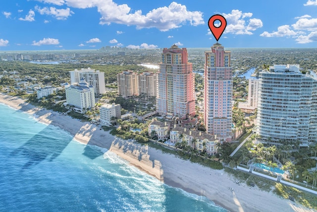 bird's eye view featuring a beach view and a water view