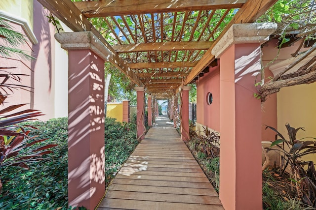 property entrance with a pergola