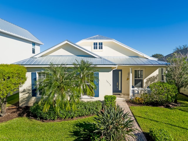 view of front of home with a front lawn and covered porch