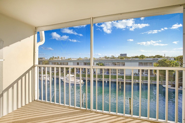 balcony featuring a water view