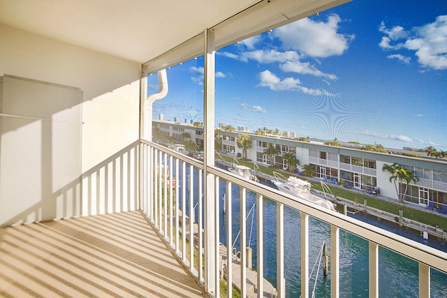 balcony featuring a water view