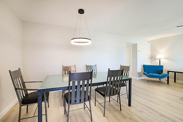 dining space featuring light hardwood / wood-style floors