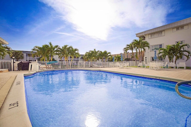 view of swimming pool with a patio