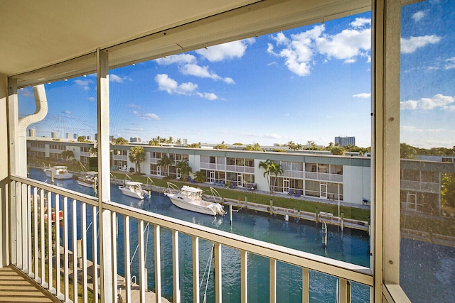 balcony featuring a water view