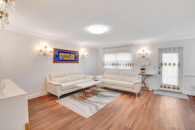 living room with hardwood / wood-style flooring and crown molding