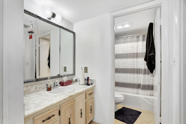 full bathroom with tile patterned floors, shower / tub combo with curtain, vanity, and toilet