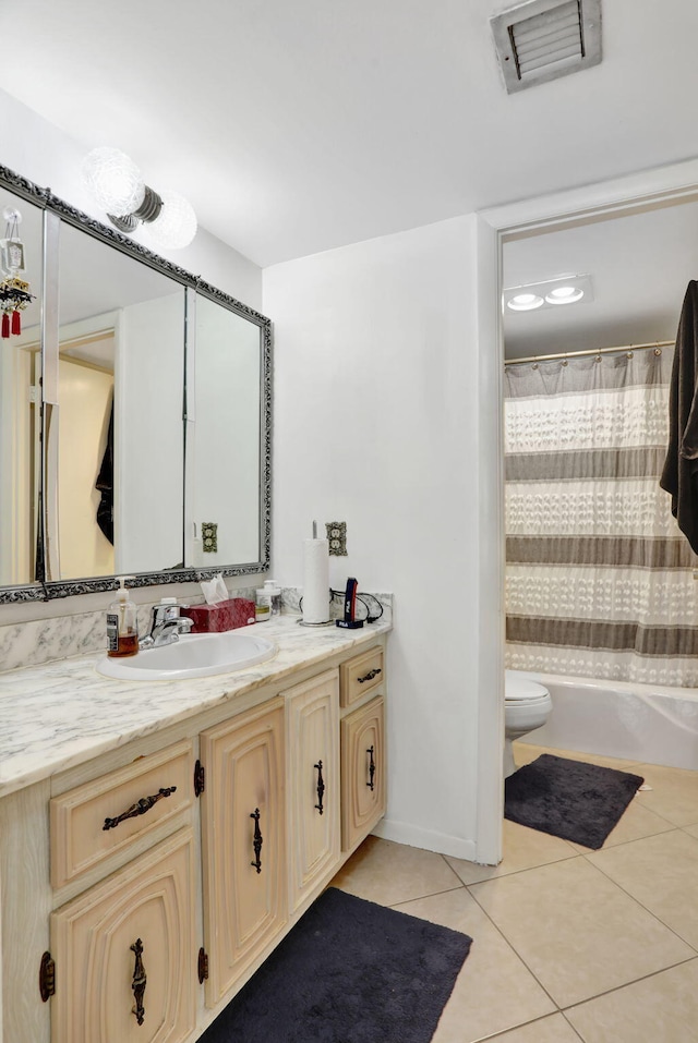 bathroom with tile patterned floors, vanity, and toilet